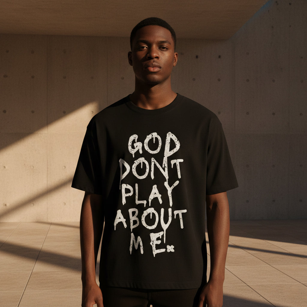 GOD DON’T PLAY ABOUT ME – Unisex Boxy Cotton T-Shirt (Black)