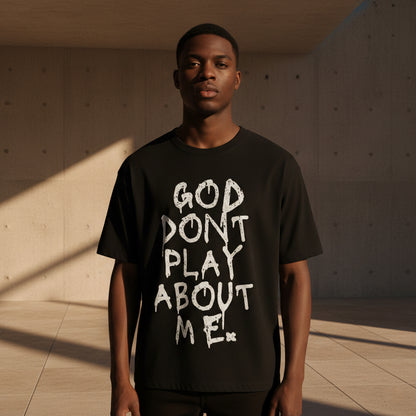 GOD DON’T PLAY ABOUT ME – Unisex Boxy Cotton T-Shirt (Black)