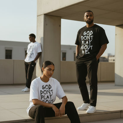 GOD DON’T PLAY ABOUT ME – Unisex Boxy Cotton T-Shirt (Black)